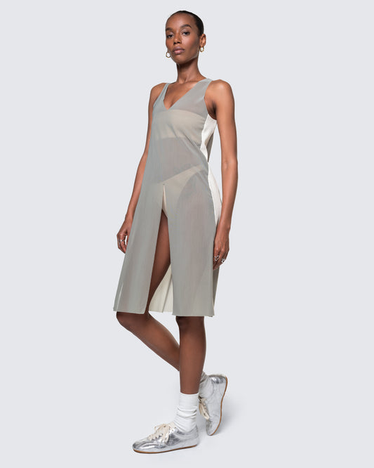 12Twelve Air Dress in Sage shown from the side with layered styling and sporty sneakers