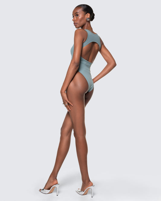Side view of 12Twelve tide blue bodysuit featuring high-leg silhouette and stretch fit