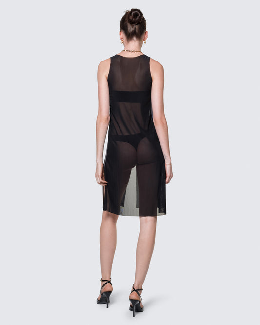 Full-body view of the black 12Twelve Air Dress styled with heels for an elevated minimal look