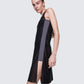 Side view of 12Twelve Air Dress in Black featuring front slit and layered styling
