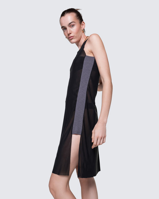Side view of 12Twelve Air Dress in Black featuring front slit and layered styling