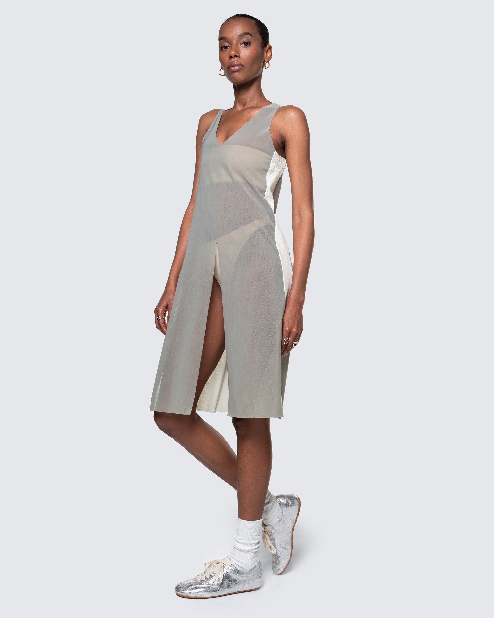 12Twelve Air Dress in Sage shown from the side with layered styling and sporty sneakers