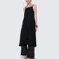 12Twelve black reversible dress styled with pants, showcasing flowy silhouette