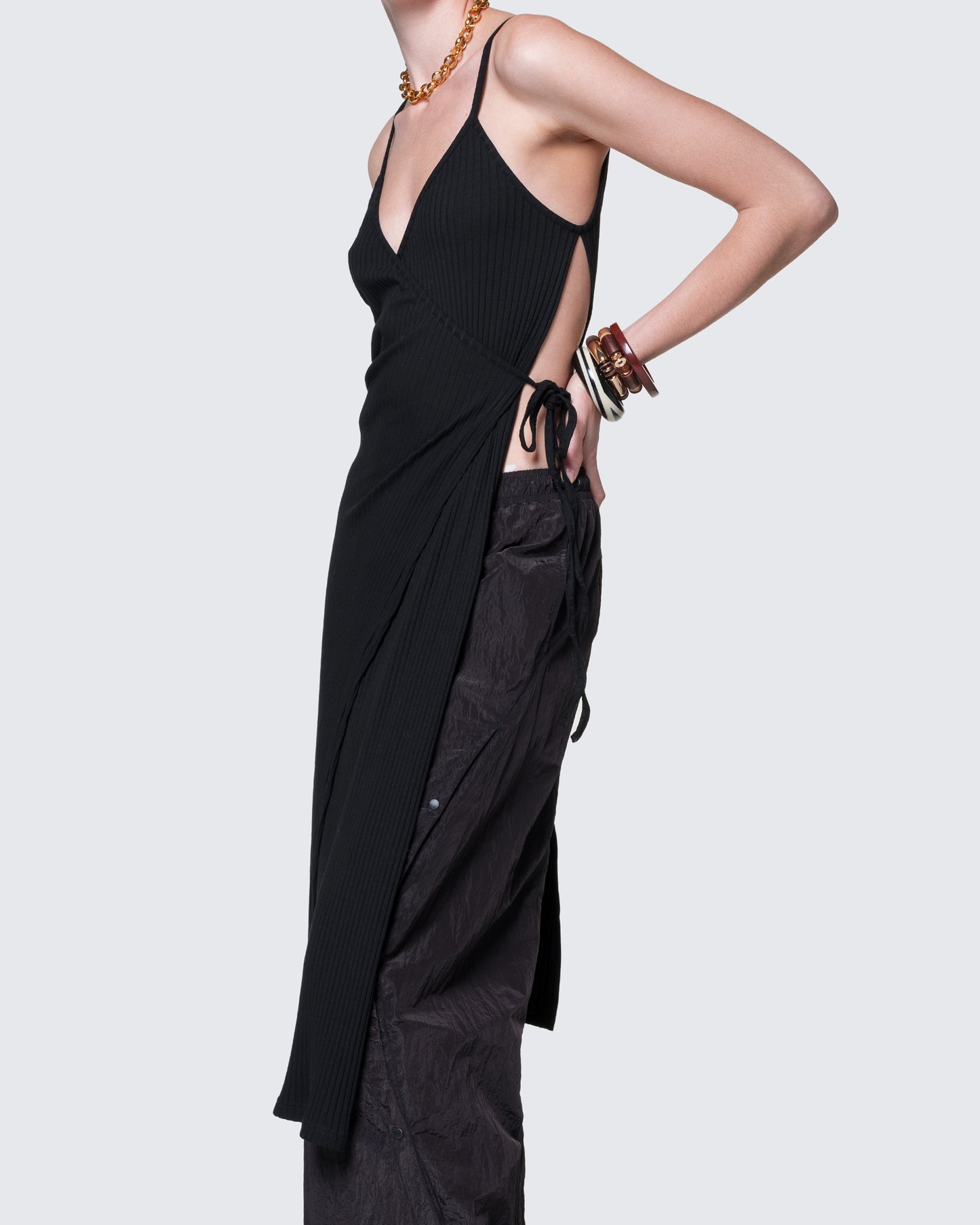 Side angle of reversible dress highlighting front wrap panel and layered fit