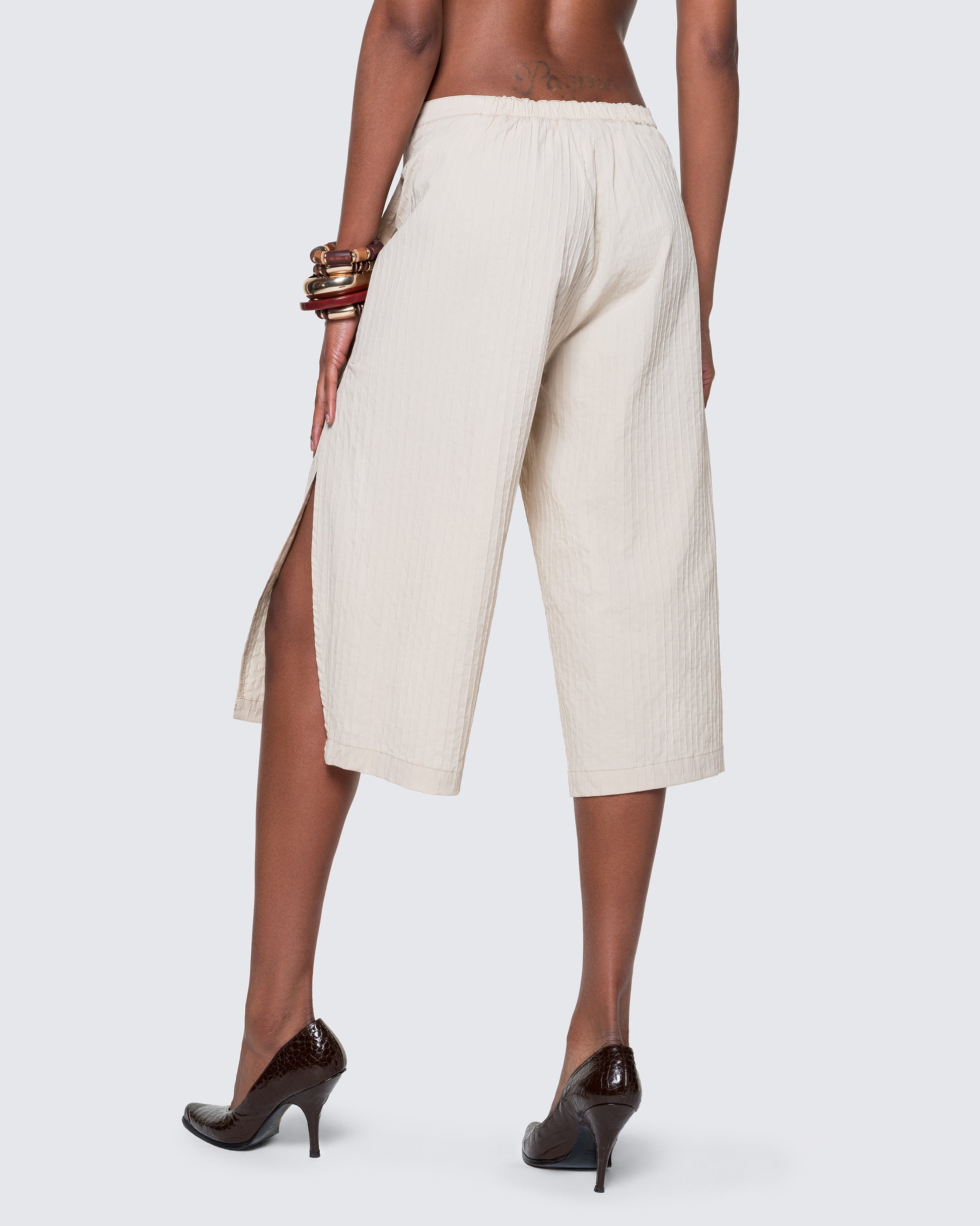 Back angle of the 12Twelve Ease Short in ivory showcasing relaxed drape and elastic waistband for comfortable fit