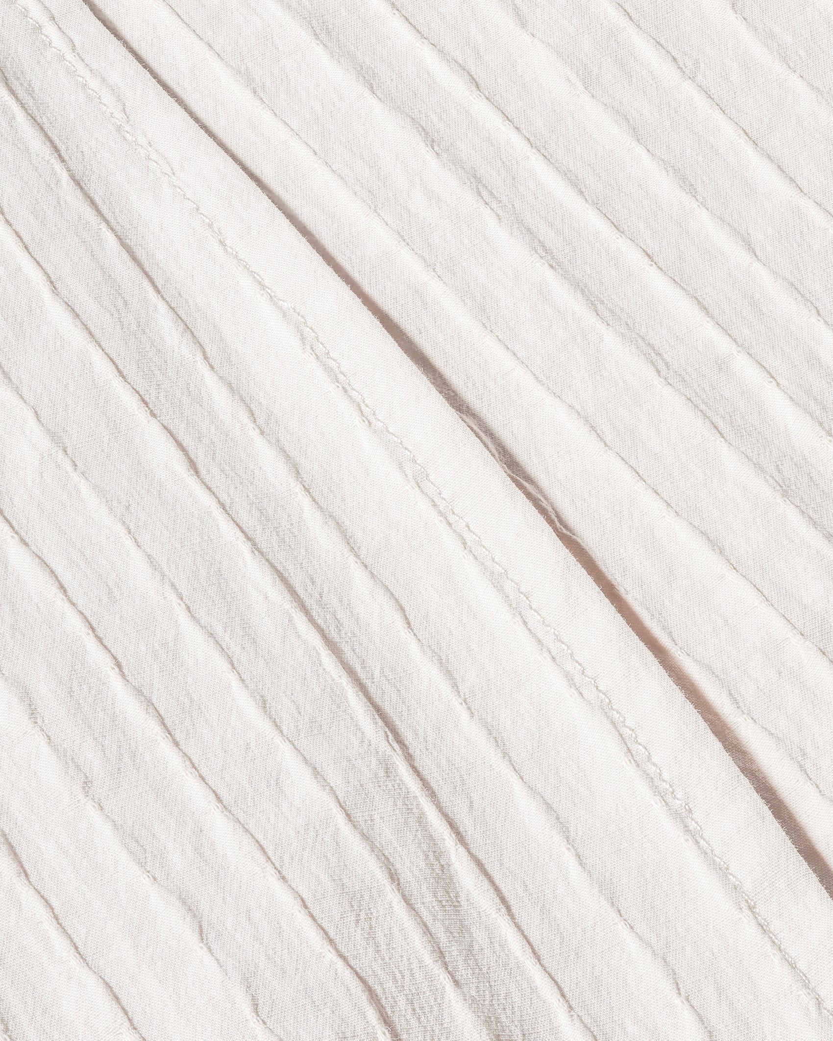 Macro image of soft ribbed fabric on the Ease Short in ivory by 12Twelve