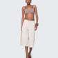 Model walking in 12Twelve Ease Short, styled with crop top and heels