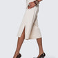 Side view of 12Twelve Ease Short showing flowy cut and slit detail