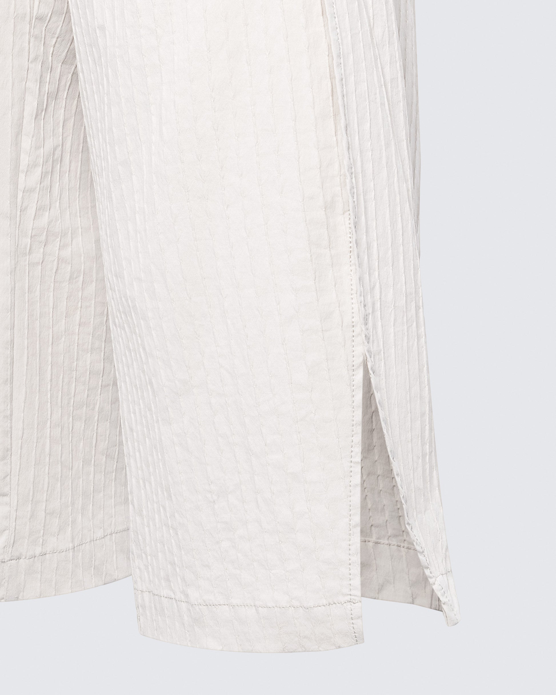 Close-up of curved side slit on the 12Twelve Ease Short, highlighting movement-friendly design