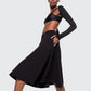 Model wearing 12Twelve Heavenly Skirt in black with asymmetric long sleeve top