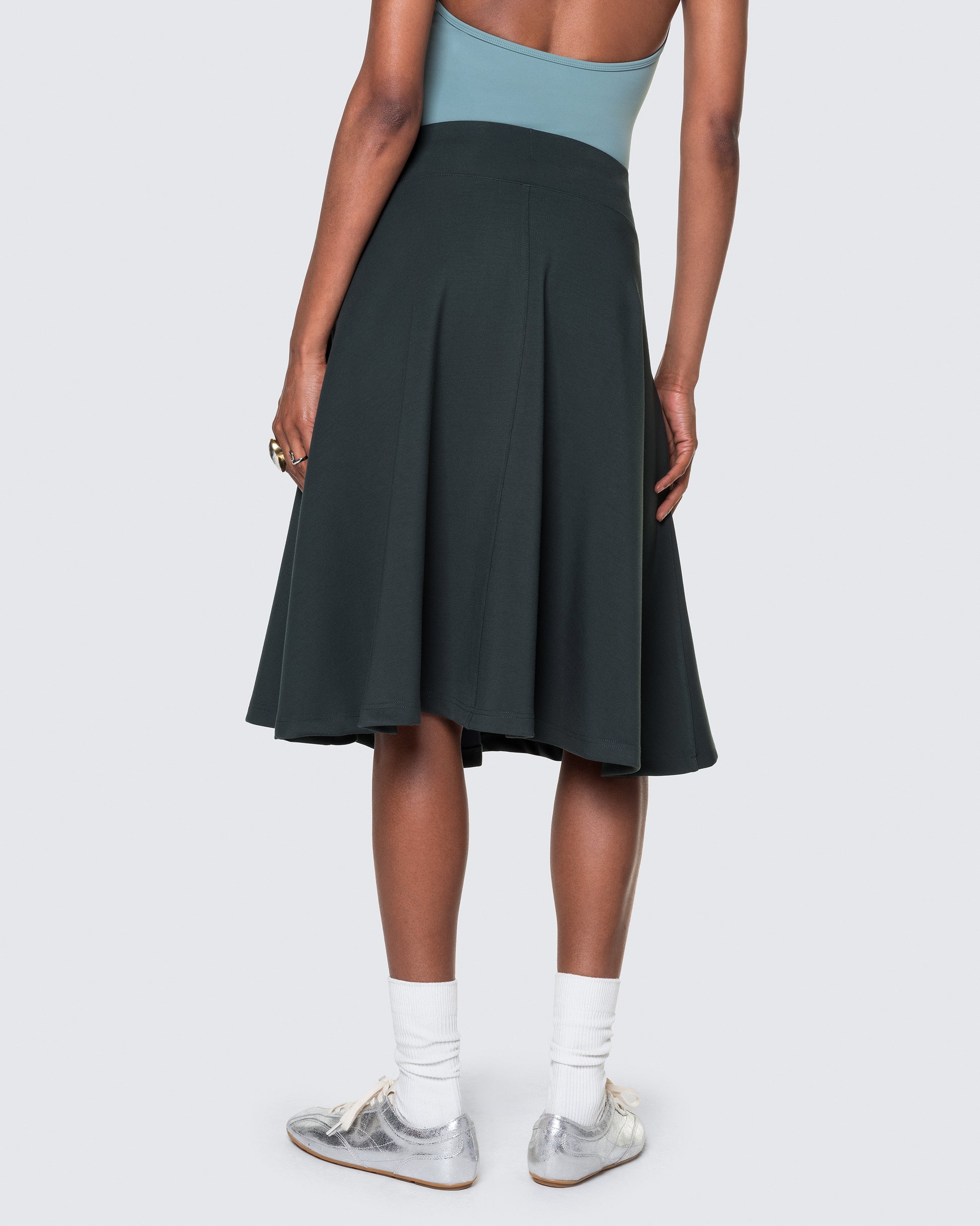 Back angle of 12Twelve’s emerald green Heavenly Skirt featuring a soft A-line silhouette