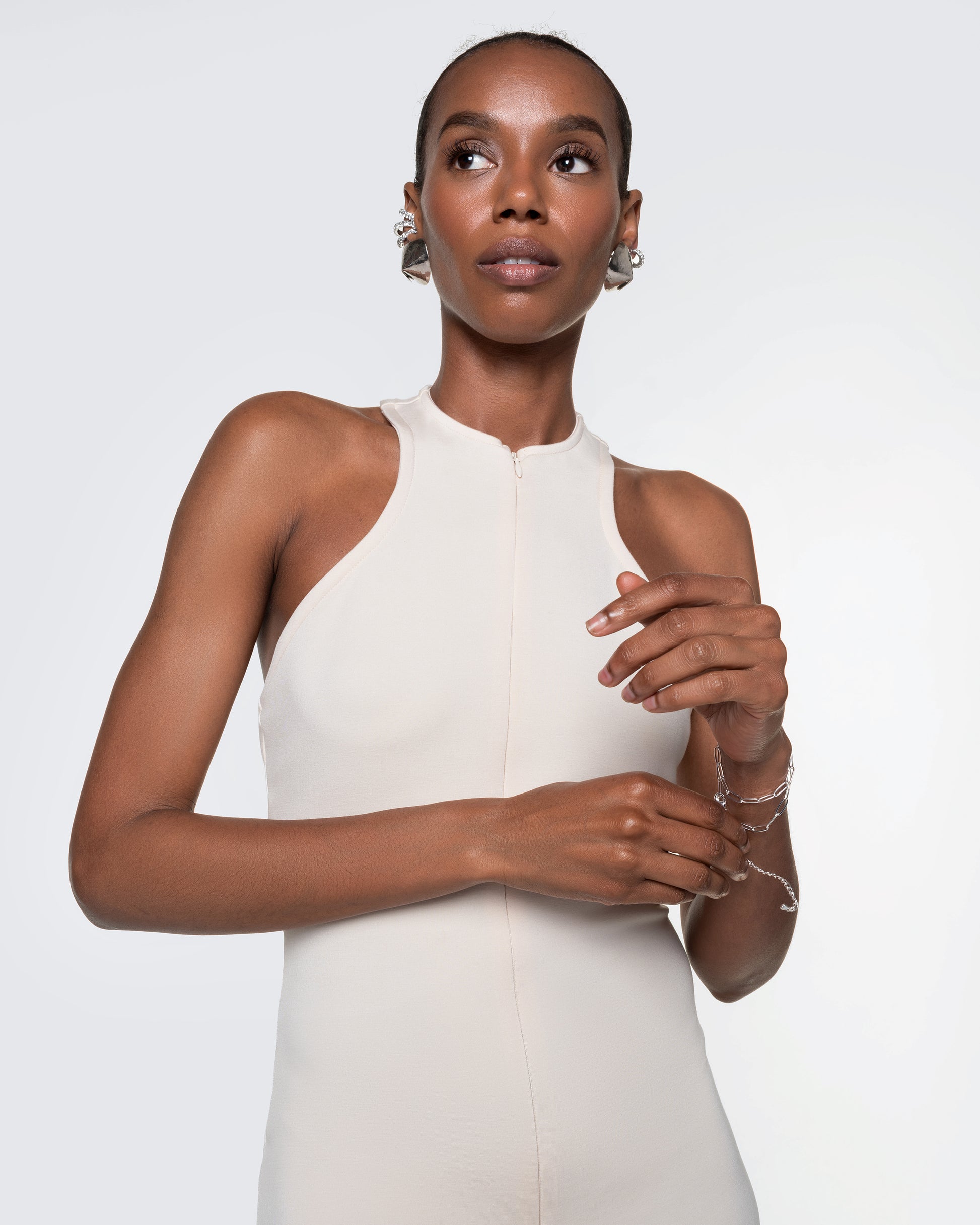 Close-up of 12Twelve Form Dress in ivory with halter-inspired cut and sleek fit