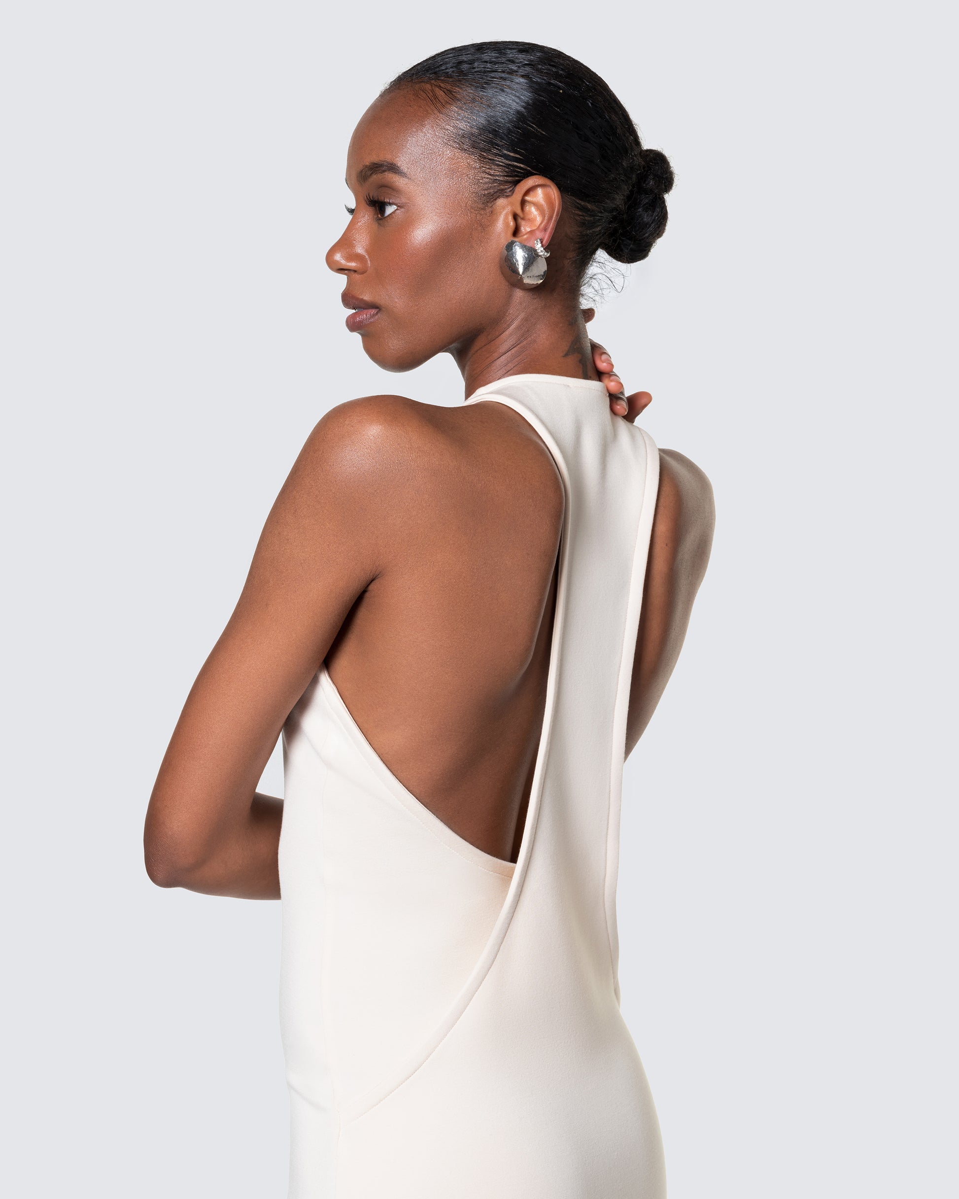 Side-back view of 12Twelve Form Dress in ivory showcasing dramatic scoop back