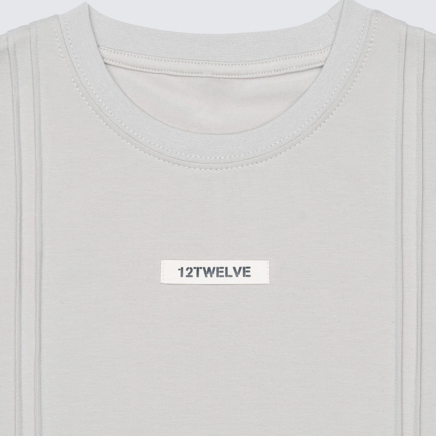 Macro shot of the 12twelve line see showing the architectural seam details and suede logo patch. 
