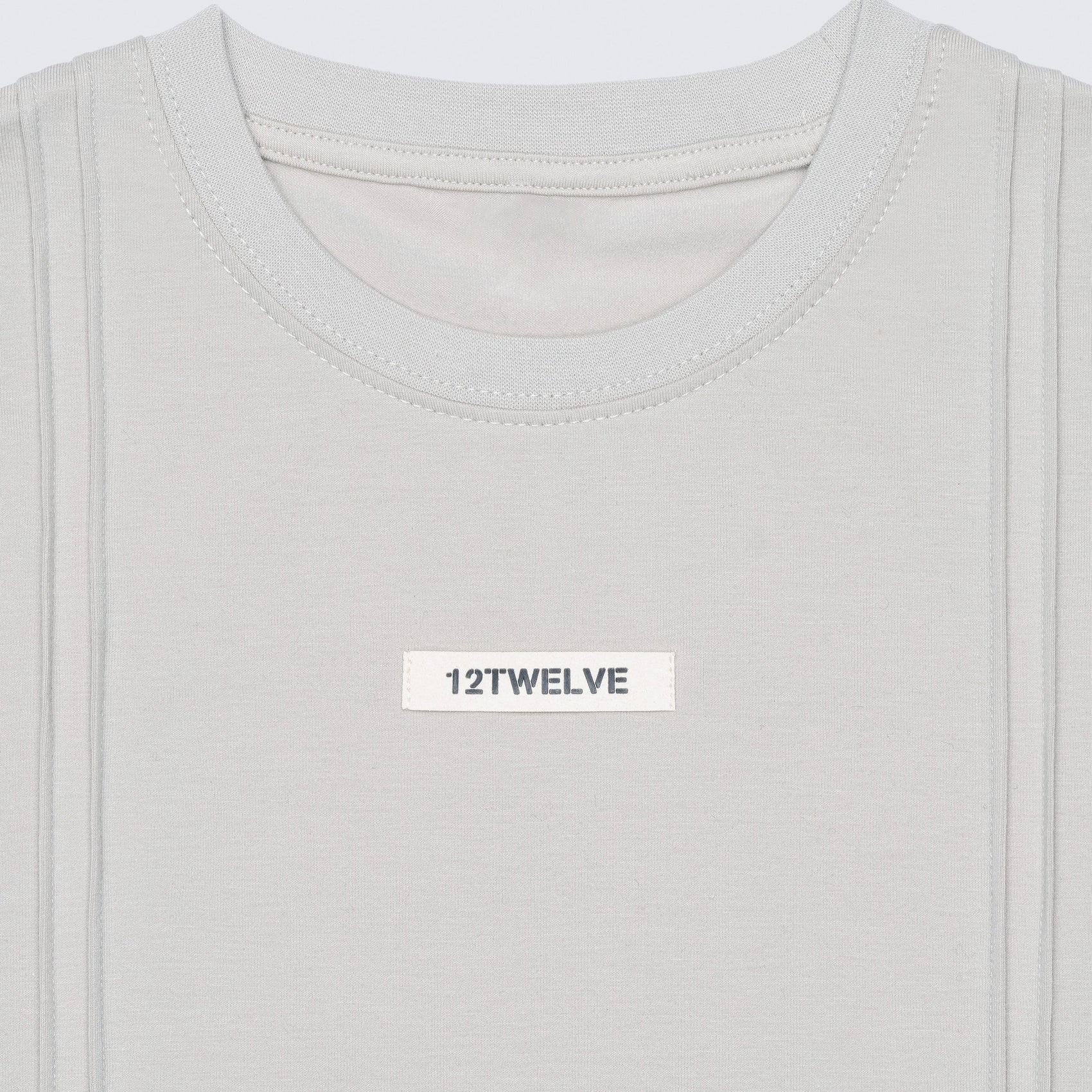 Macro shot of the 12twelve line see showing the architectural seam details and suede logo patch. 