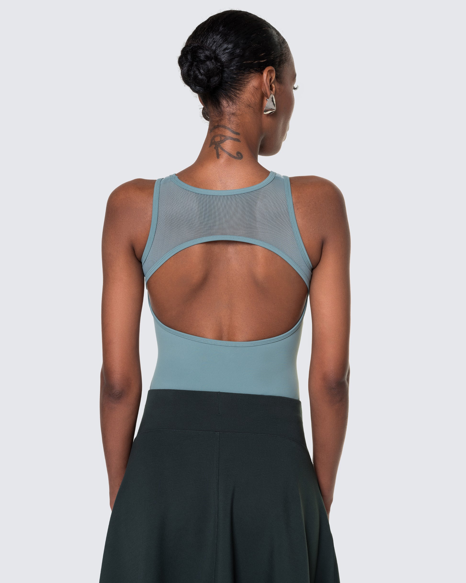 Back of 12Twelve bodysuit in tide blue with mesh and oval cut-out detail