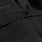 Detailed shot of 12Twelve track pants snap button and tonal seam on tech-style crinkle fabric