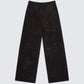 Flat lay of 12Twelve black track pants displaying wide leg silhouette and casual fit design