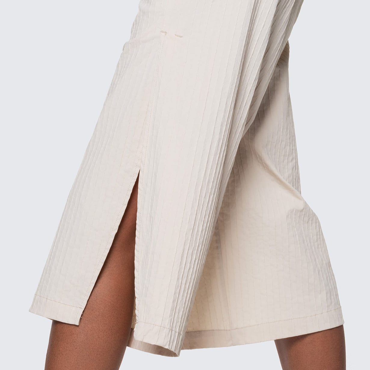 A profile view of the 12twelve Ease Short to show the curved slit and soft textured cotton.