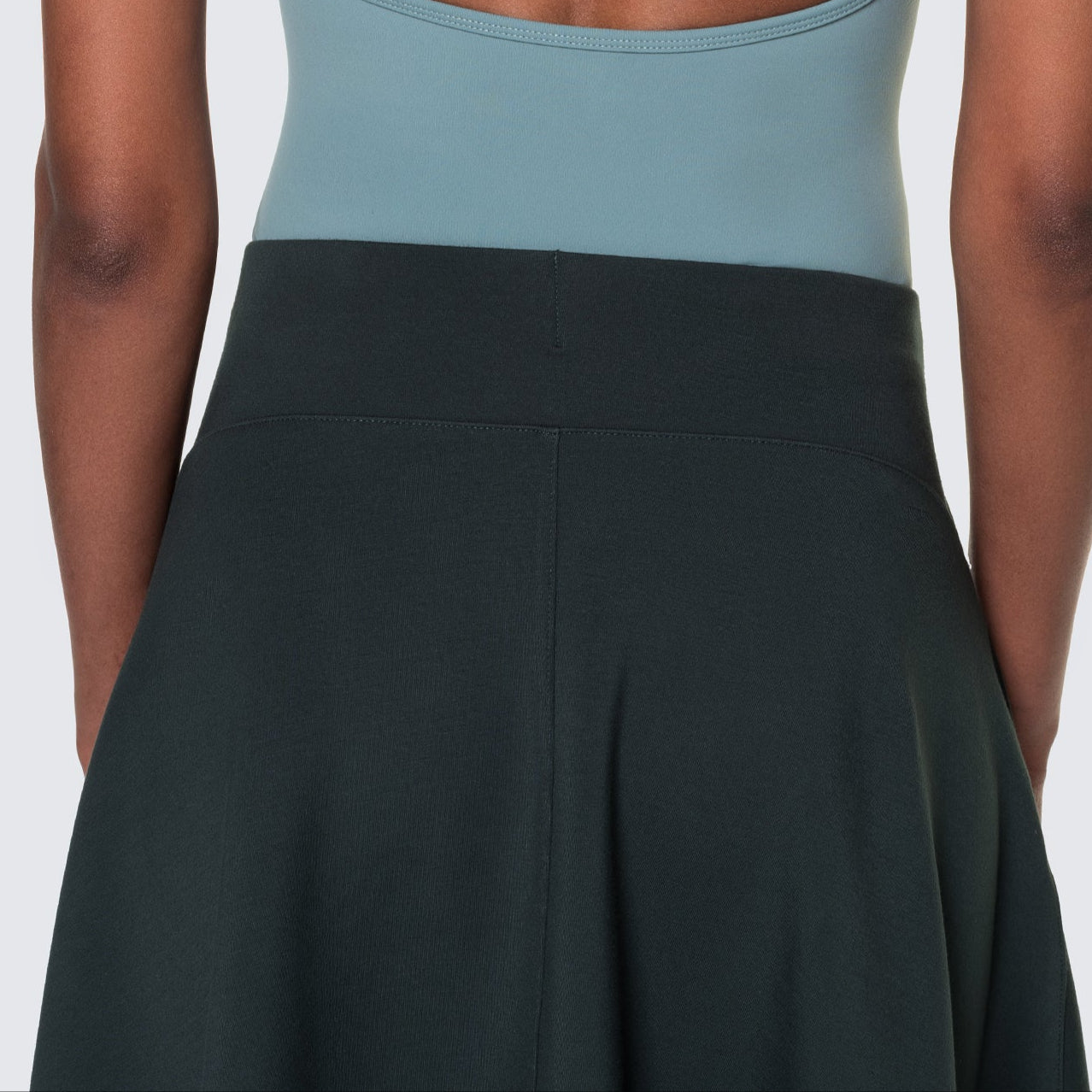 Square image showing the back waistbnd of the emerald green heavenly skirt. 